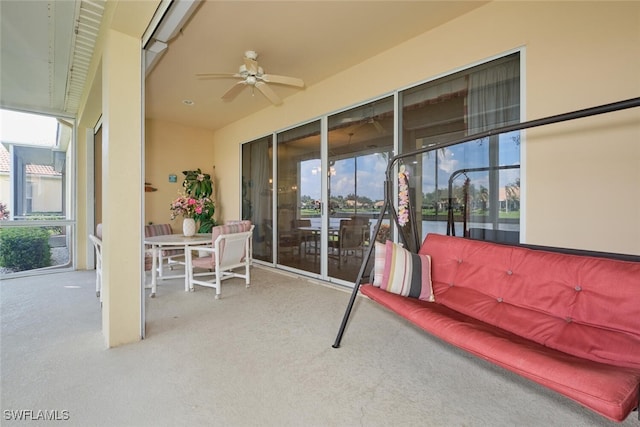 sunroom featuring ceiling fan