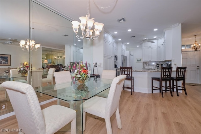 dining area with light hardwood / wood-style floors and ceiling fan