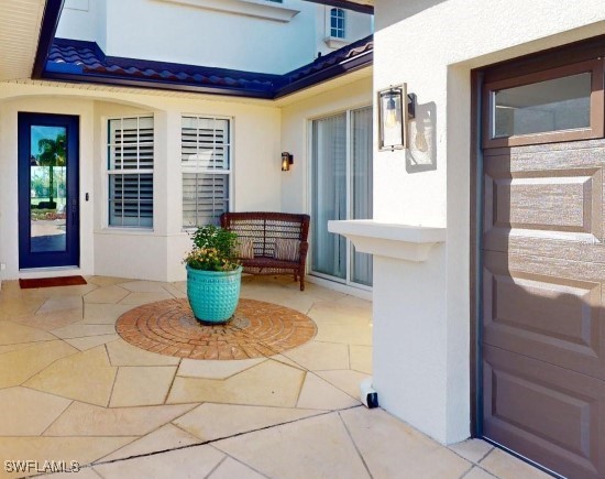 property entrance with a patio area