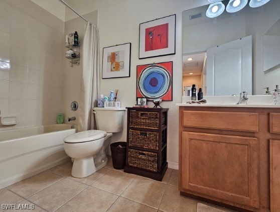 full bathroom featuring tile patterned flooring, vanity, shower / bath combo with shower curtain, and toilet