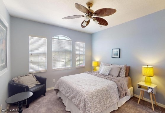 carpeted bedroom with ceiling fan