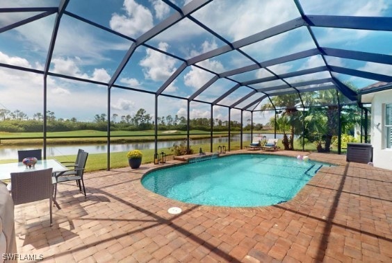 view of pool with a lanai, a patio, and a water view