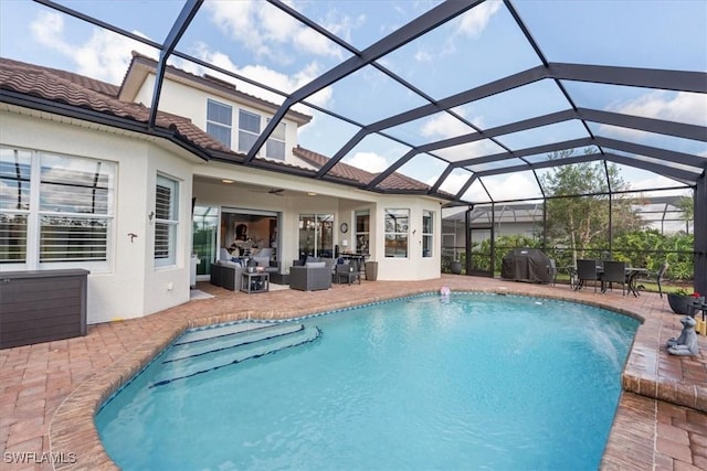 pool featuring a patio, outdoor lounge area, grilling area, ceiling fan, and a lanai