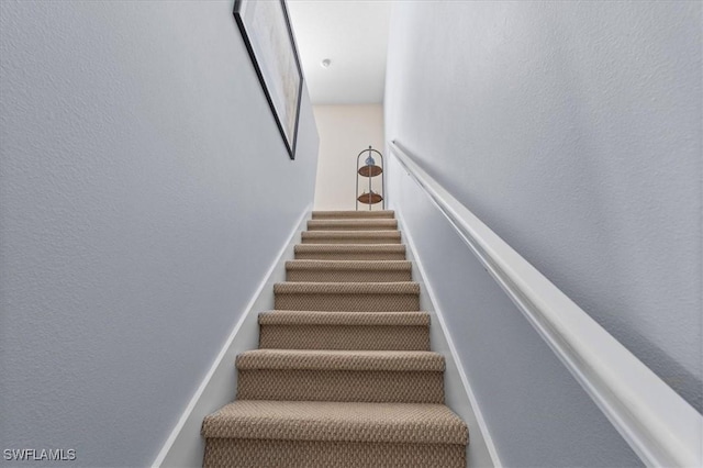 stairs with a textured wall