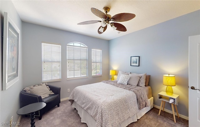 bedroom featuring carpet flooring, ceiling fan, and baseboards