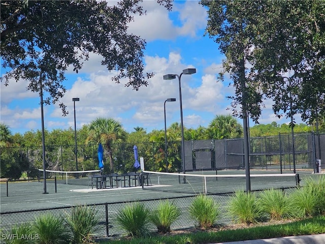 view of sport court with fence