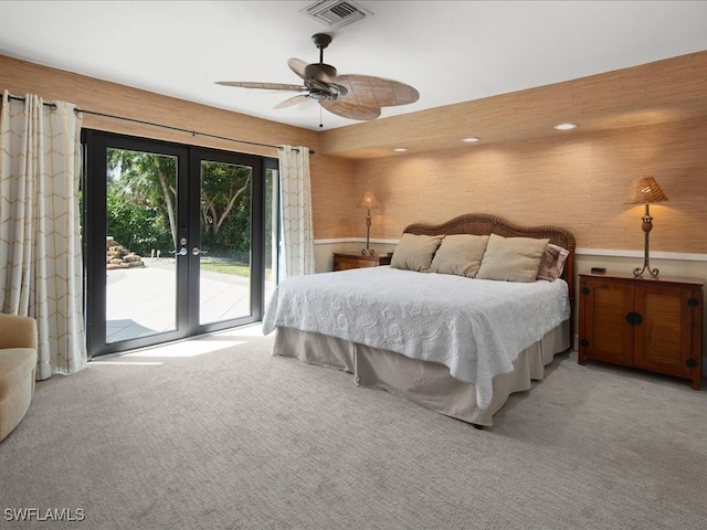 bedroom with light carpet, ceiling fan, access to exterior, and french doors