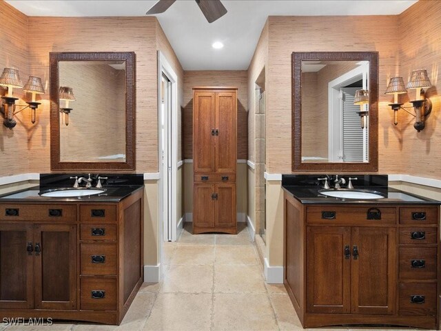 bathroom with ceiling fan and vanity