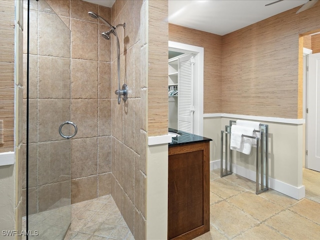 bathroom with a shower with door