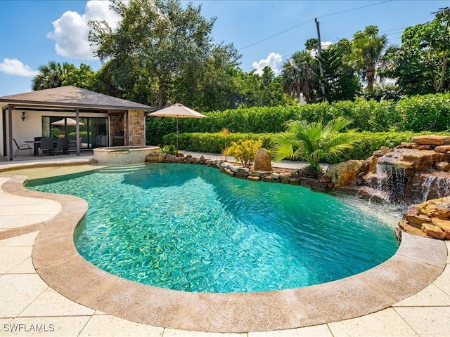 view of swimming pool with a patio