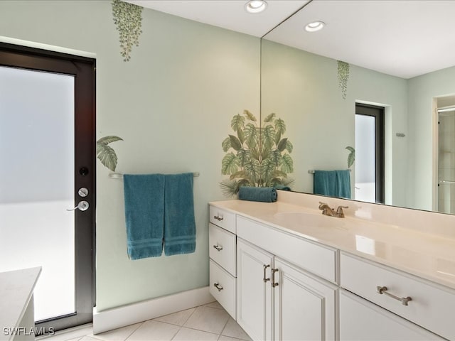 bathroom with tile patterned floors and vanity