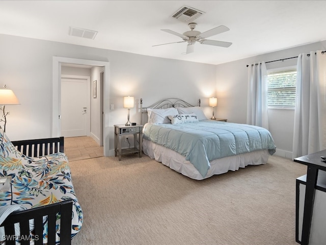 bedroom featuring light carpet and ceiling fan