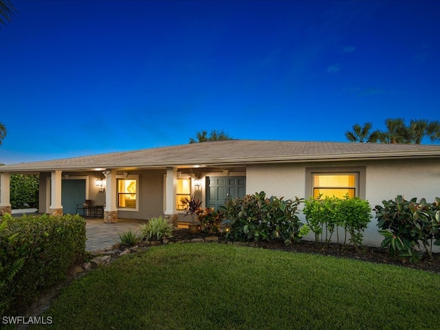 single story home featuring a patio and a front lawn