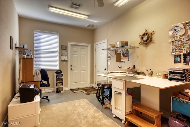 home office featuring concrete floors