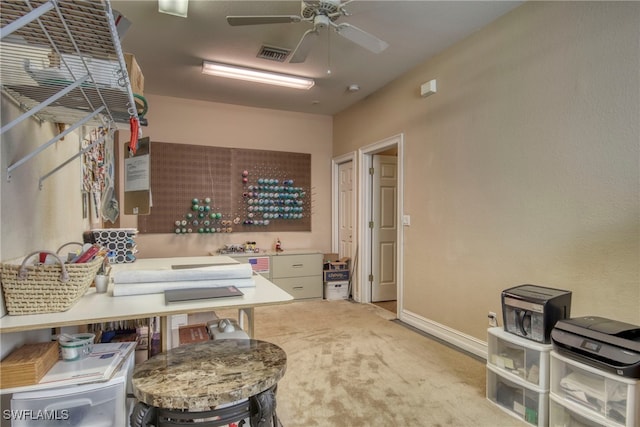 misc room with ceiling fan and light colored carpet