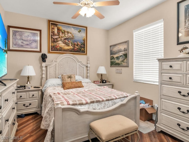 bedroom featuring ceiling fan and dark hardwood / wood-style flooring