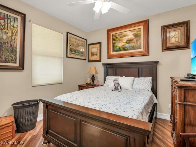 bedroom featuring wood-type flooring and ceiling fan