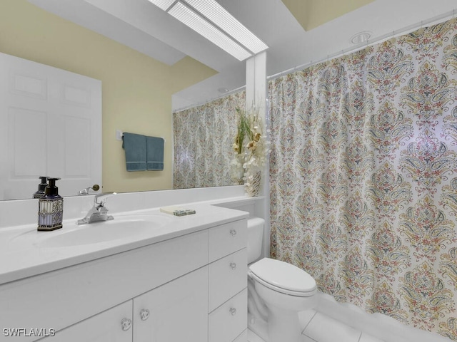 bathroom with vanity, curtained shower, toilet, and tile patterned flooring