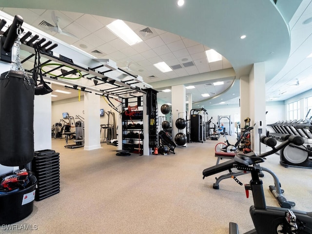 gym featuring a paneled ceiling