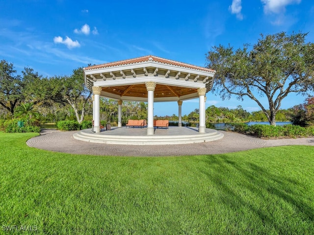 surrounding community with a gazebo and a yard