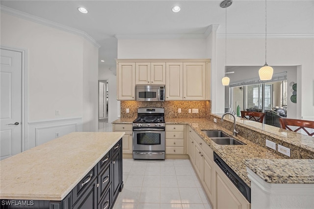 kitchen with pendant lighting, tasteful backsplash, crown molding, sink, and appliances with stainless steel finishes