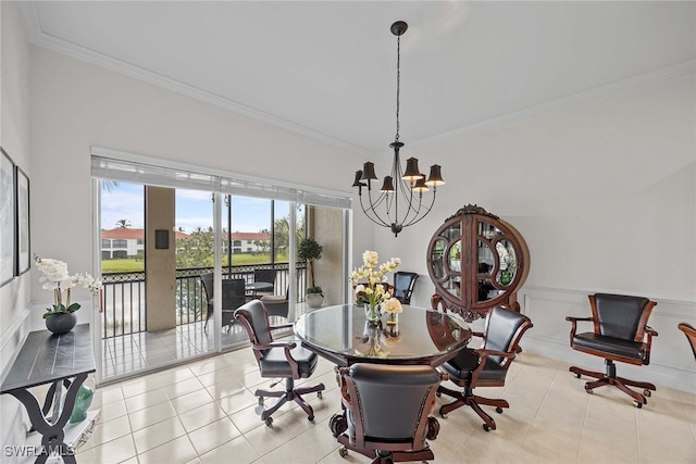 tiled dining room featuring ornamental molding and an inviting chandelier