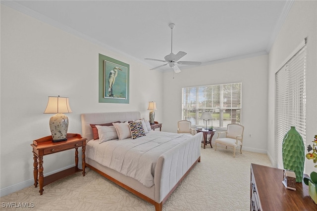 carpeted bedroom featuring ornamental molding and ceiling fan