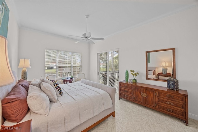 bedroom with ceiling fan, access to outside, ornamental molding, and multiple windows