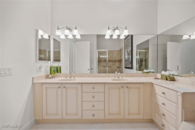 bathroom featuring tile patterned flooring, walk in shower, and vanity