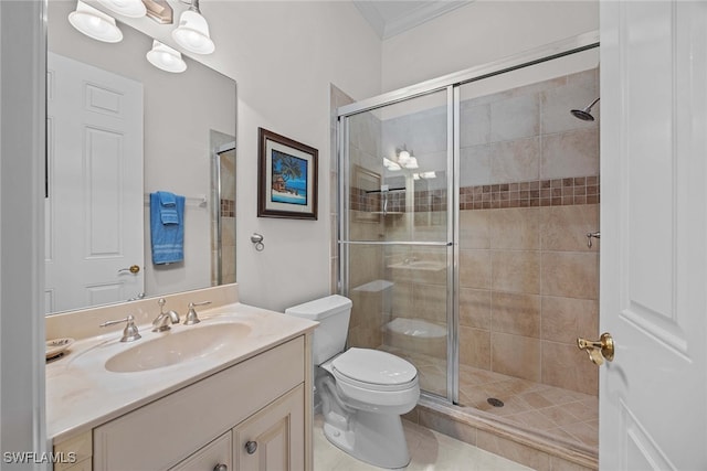 bathroom with vanity, toilet, an enclosed shower, crown molding, and tile patterned flooring