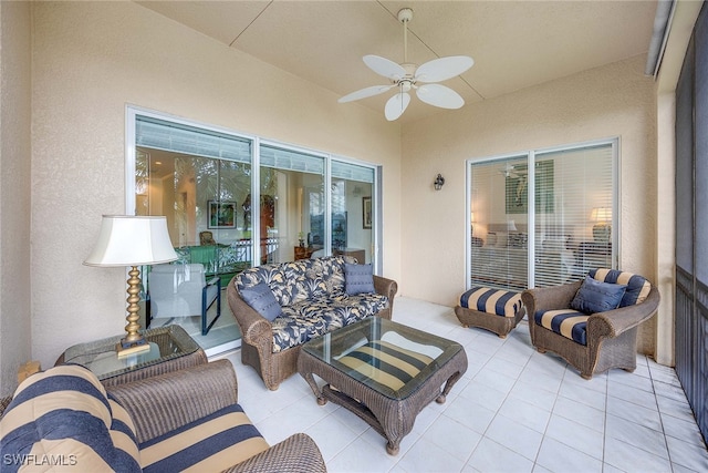 view of patio / terrace with ceiling fan and an outdoor living space