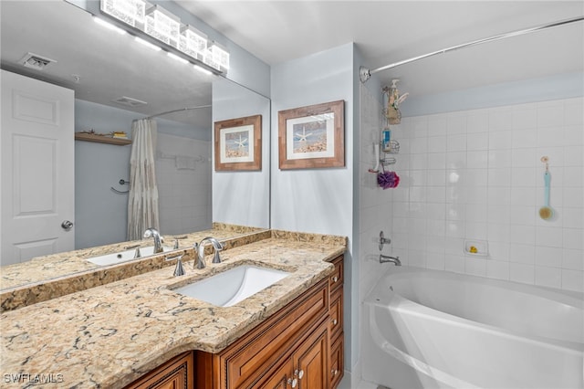 bathroom featuring vanity and shower / bath combo