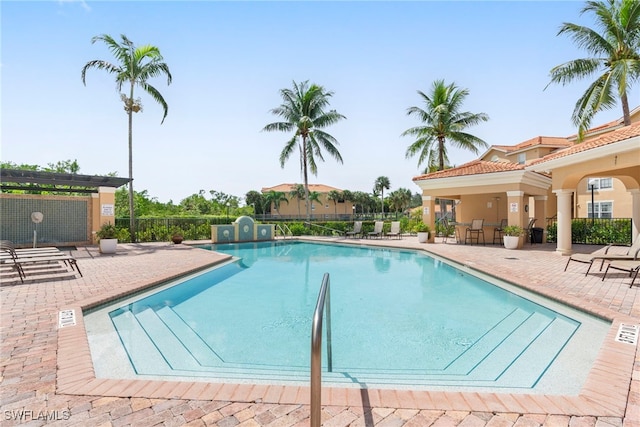 view of swimming pool featuring a patio area