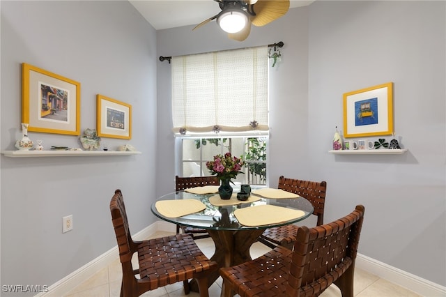 dining area with ceiling fan and light tile patterned flooring