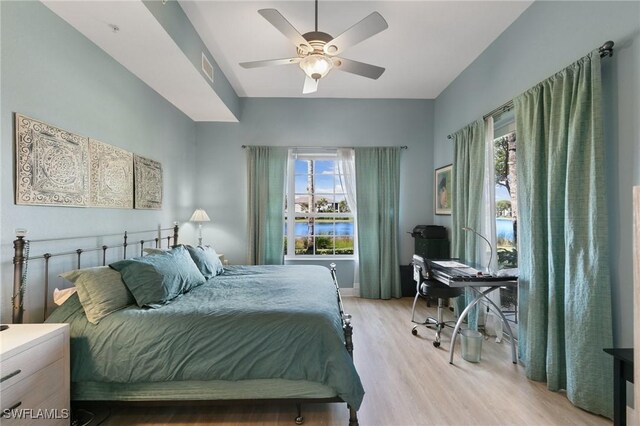 9235 Tesoro Ln Unit 4-102, Naples, FL 34114 - bedroom with light wood-style floors, ceiling fan, and visible vents
