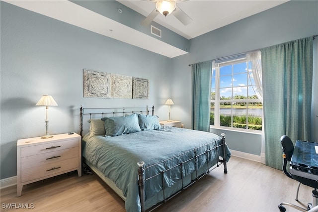 bedroom with ceiling fan and light wood-type flooring