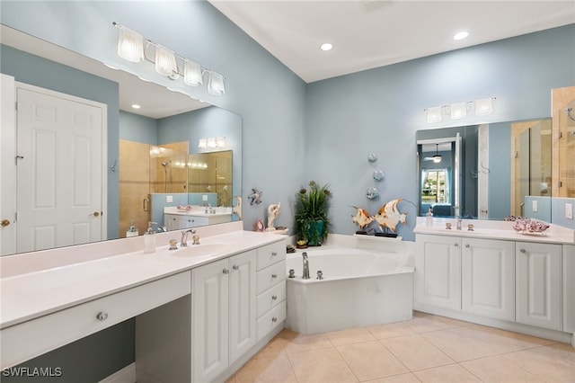 bathroom with independent shower and bath, tile patterned flooring, and vanity