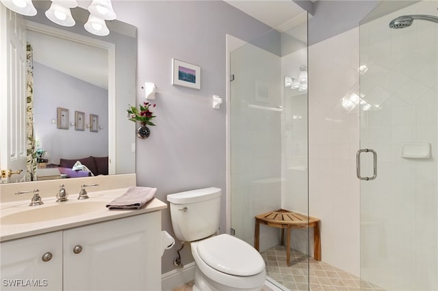 bathroom featuring walk in shower, vanity, and toilet