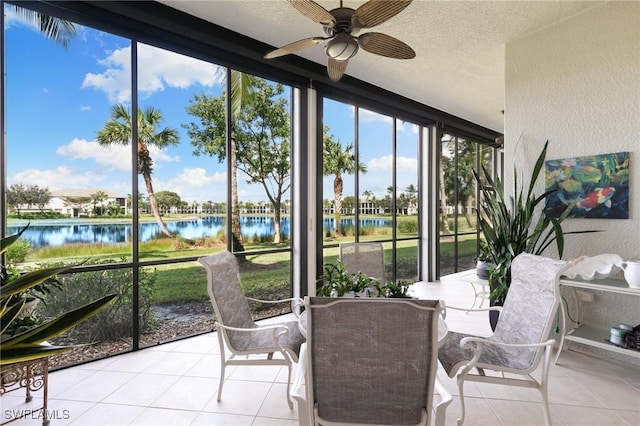 9235 Tesoro Ln Unit 4-102, Naples, FL 34114 - sunroom / solarium with a water view, tile patterned flooring, a textured wall, and a textured ceiling