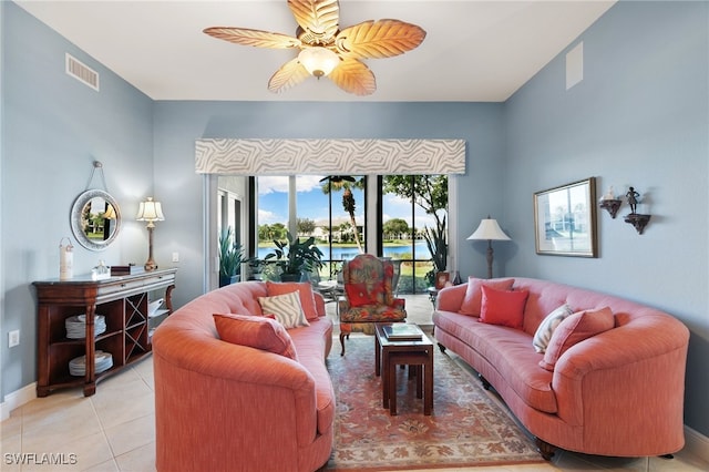 tiled living room featuring ceiling fan