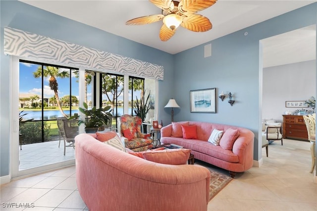 9235 Tesoro Ln Unit 4-102, Naples, FL 34114 - living area with ceiling fan, baseboards, and light tile patterned flooring