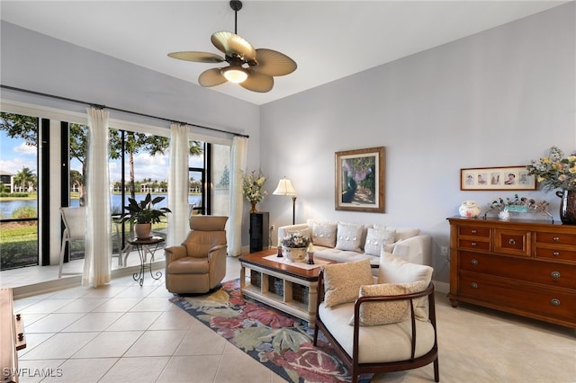 tiled living room featuring ceiling fan