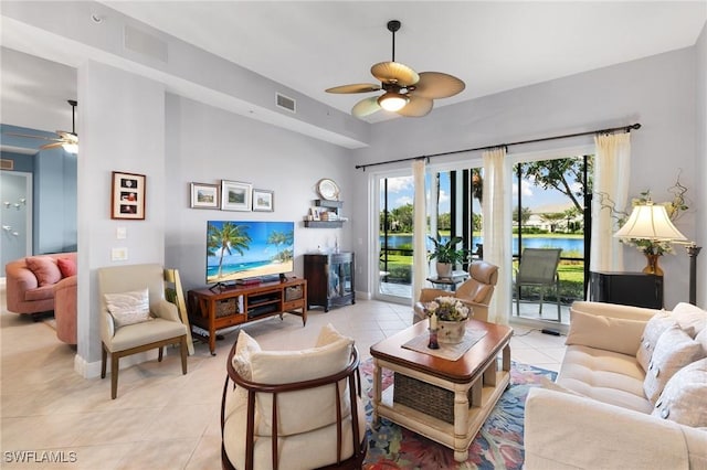 9235 Tesoro Ln Unit 4-102, Naples, FL 34114 - living area with light tile patterned floors, visible vents, and ceiling fan