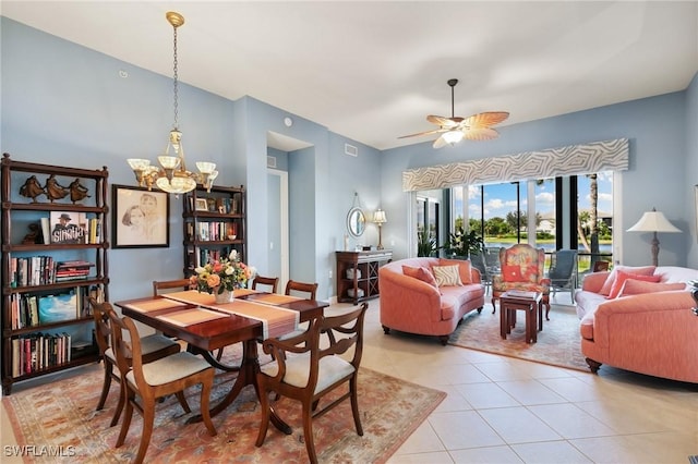 9235 Tesoro Ln Unit 4-102, Naples, FL 34114 - dining room with light tile patterned floors, visible vents, and ceiling fan with notable chandelier
