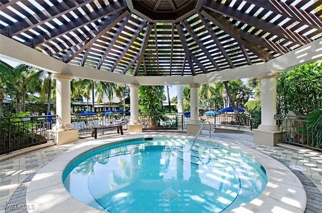 view of pool with a pergola and a patio area