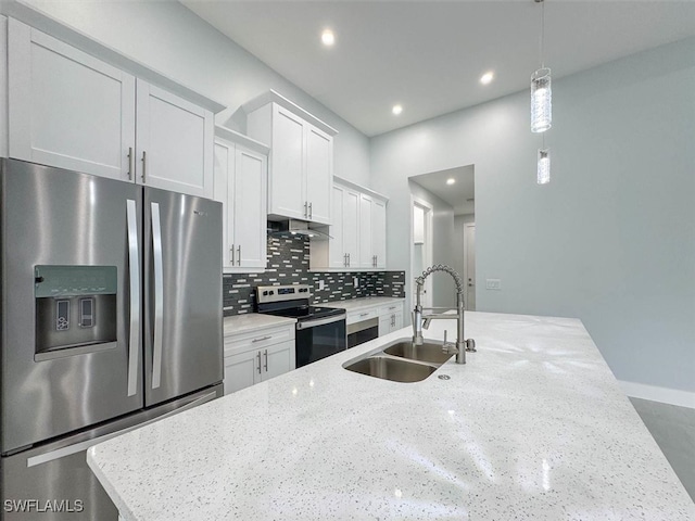 kitchen with pendant lighting, white cabinetry, appliances with stainless steel finishes, and sink