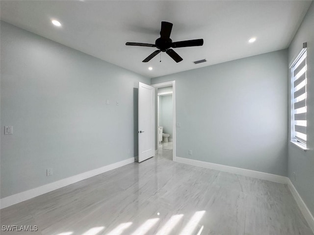 empty room with light wood-type flooring and ceiling fan