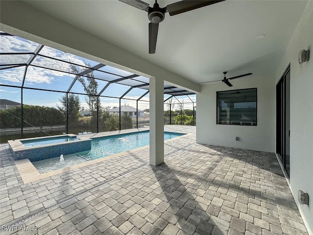 view of pool with ceiling fan, a patio, a lanai, and an in ground hot tub