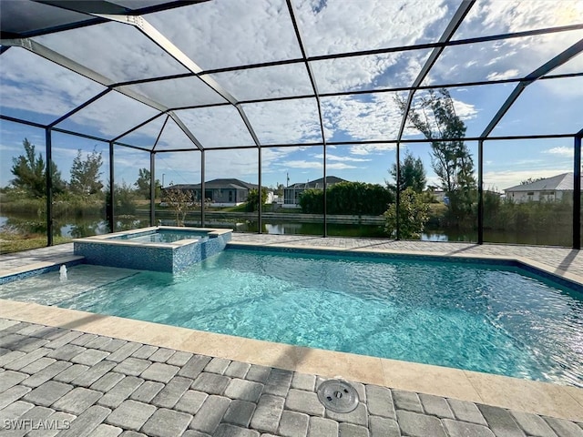 view of swimming pool featuring a lanai, a patio, a water view, and an in ground hot tub