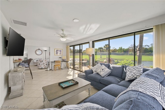 tiled living room featuring ceiling fan